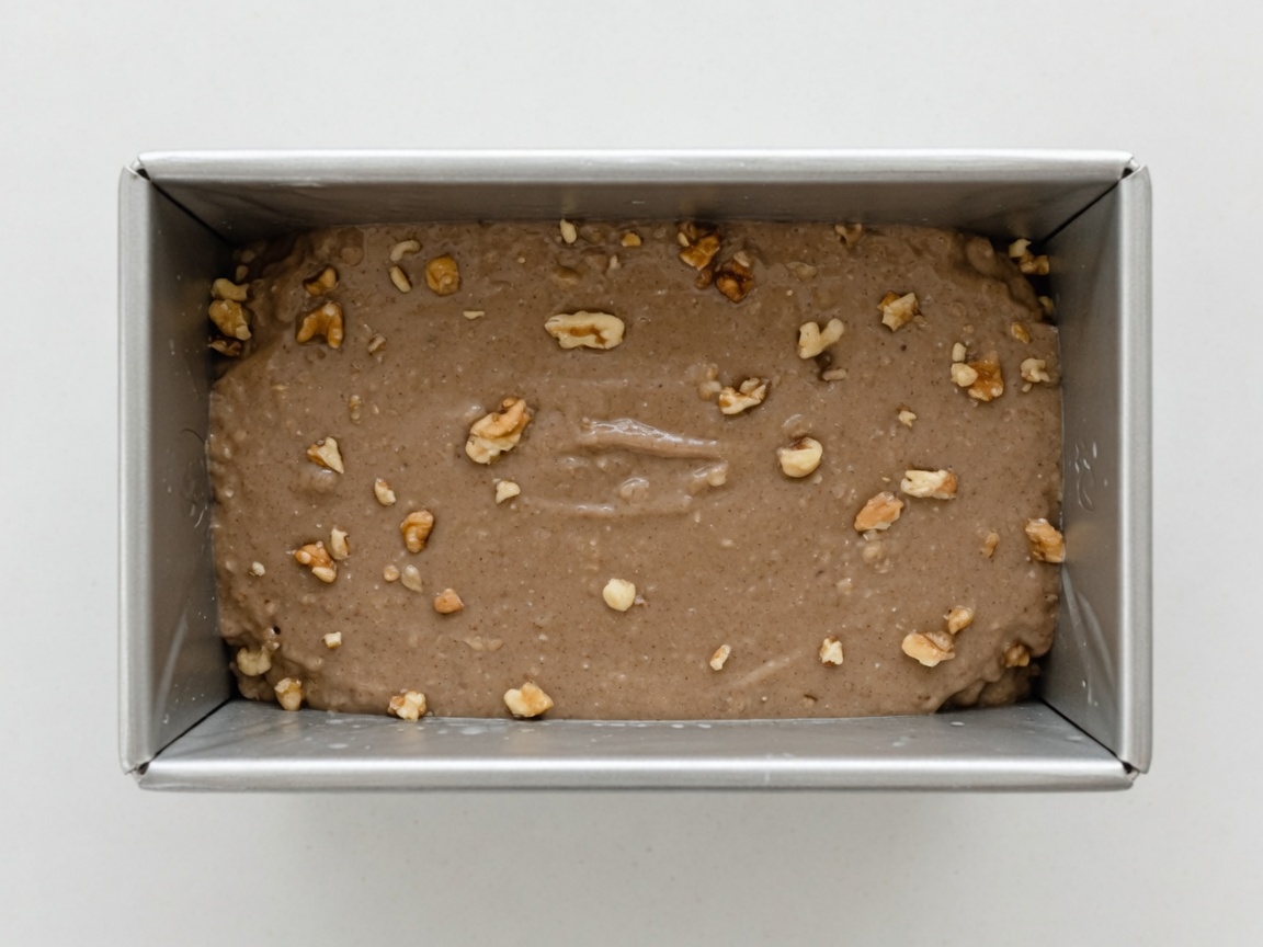 Banana walnut batter in a greased 9x5 loaf pan