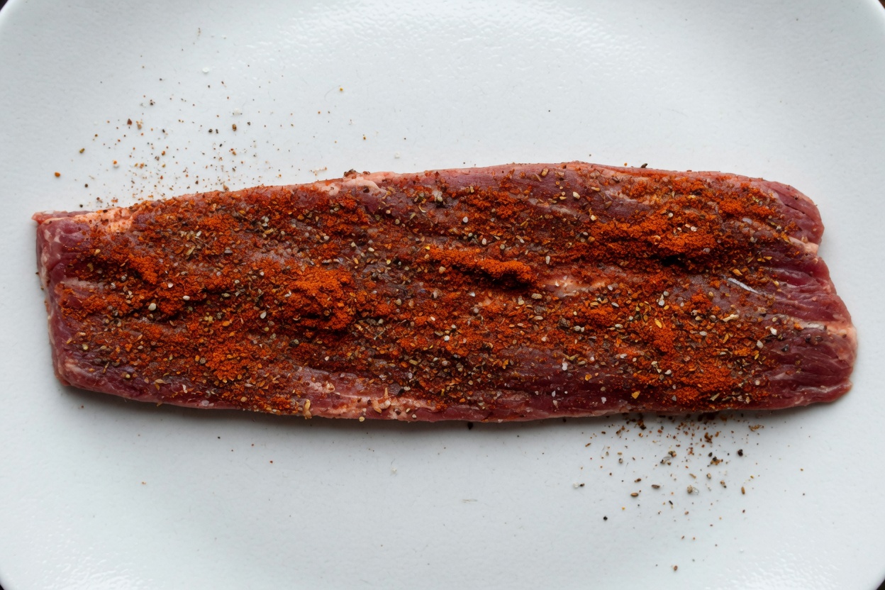 Steak rubbed with chili, cumin, salt, and pepper