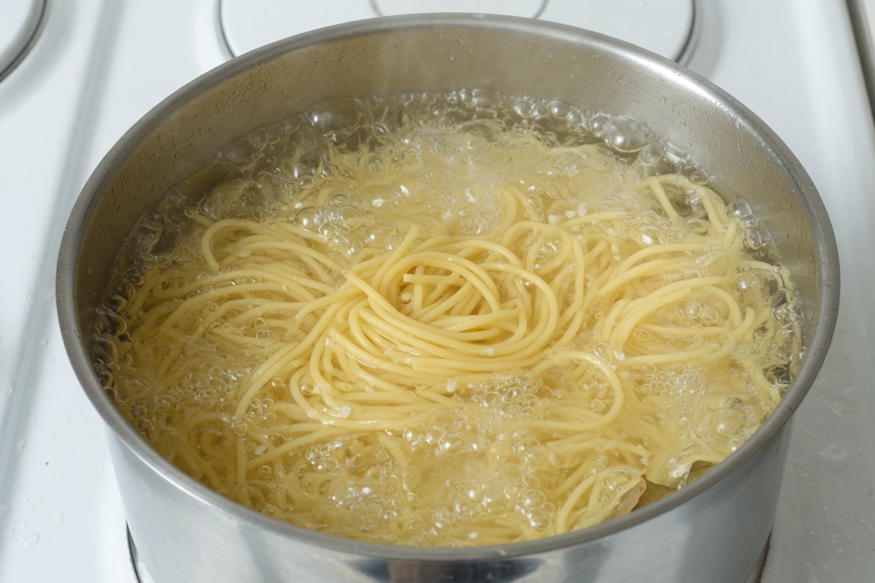 Spaghetti boiling in salted water